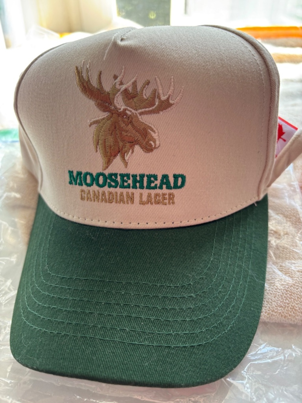 "Moosehead Lager" hat~button back closure NWT